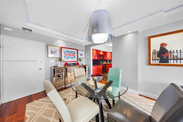 dining area with hardwood / wood-style floors