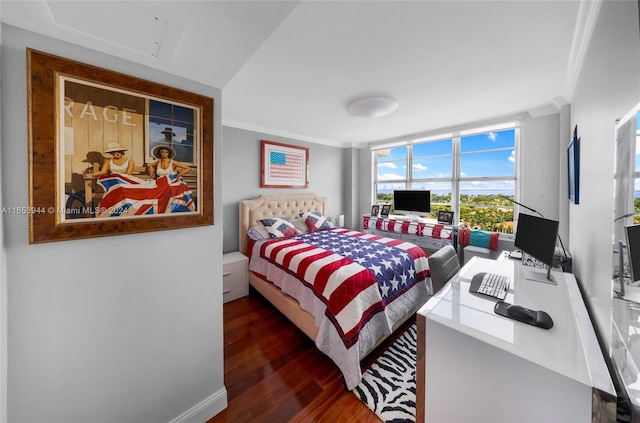 bedroom featuring ornamental molding and dark hardwood / wood-style floors