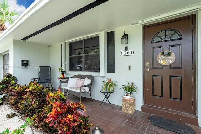 doorway to property with a porch