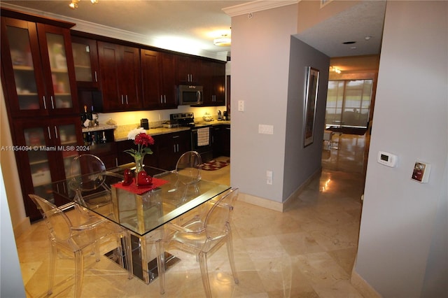 kitchen with crown molding, light tile patterned floors, and stainless steel appliances