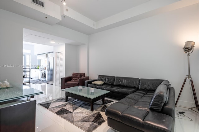 living room with light tile patterned floors