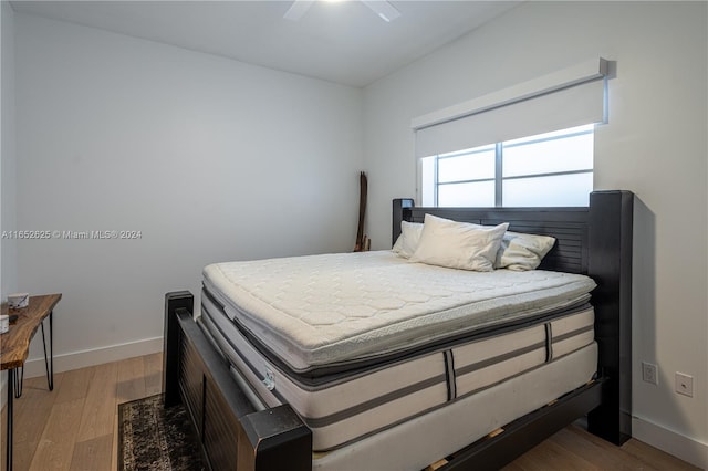 bedroom featuring ceiling fan and light hardwood / wood-style flooring