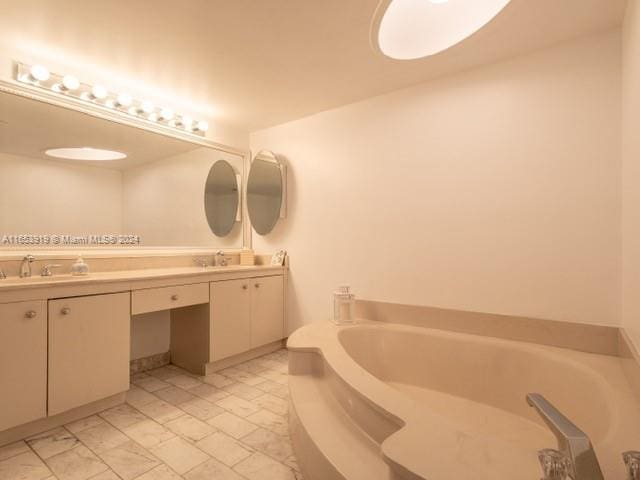 bathroom featuring a bath and vanity