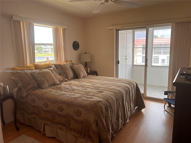 bedroom featuring ceiling fan, hardwood / wood-style flooring, and access to outside