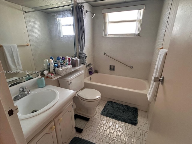 full bathroom featuring vanity, toilet, and shower / bath combination with curtain