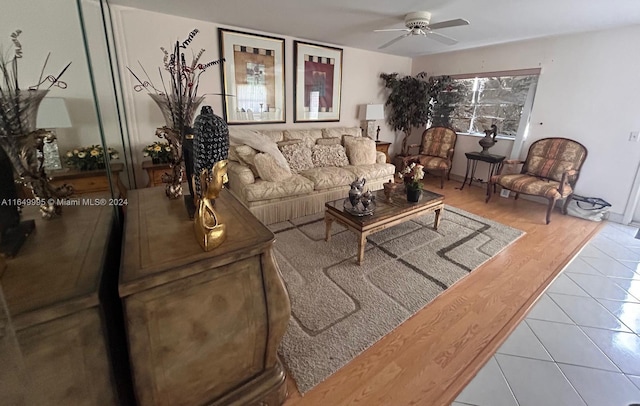 tiled living room featuring ceiling fan