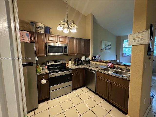 kitchen featuring hanging light fixtures, light tile patterned floors, an inviting chandelier, stainless steel appliances, and sink