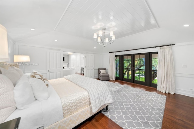 bedroom featuring access to outside, a chandelier, crown molding, dark hardwood / wood-style floors, and french doors