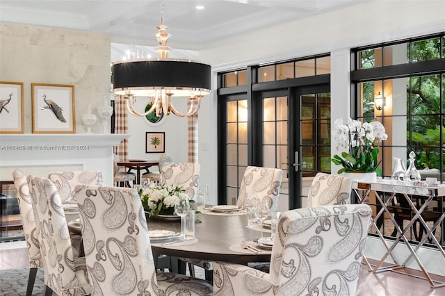 dining area featuring hardwood / wood-style floors, a notable chandelier, ornamental molding, beamed ceiling, and a wall of windows