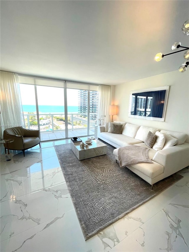 living room featuring a wealth of natural light and floor to ceiling windows