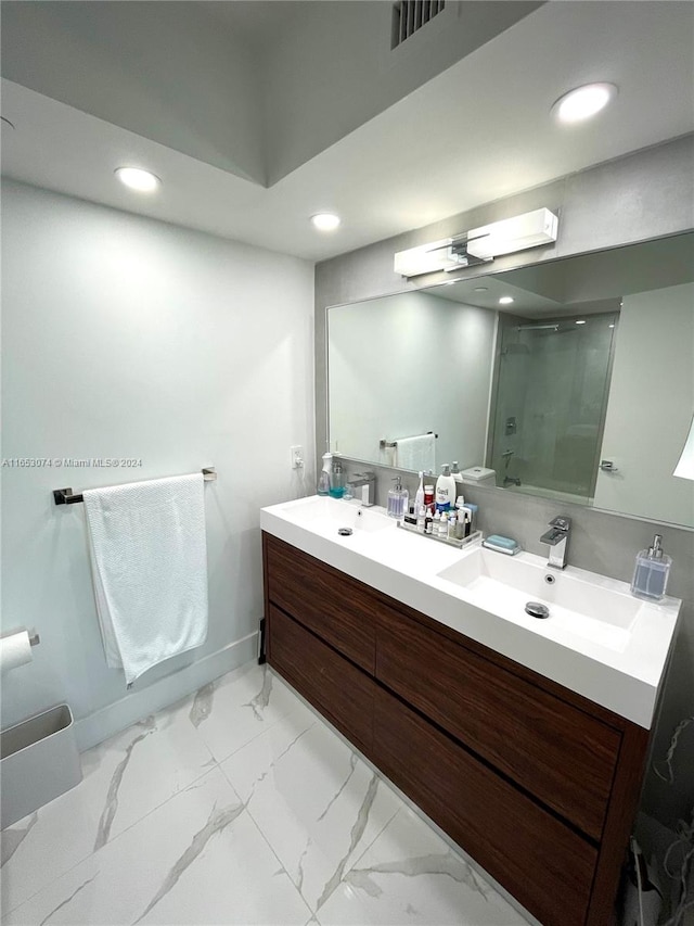 bathroom featuring vanity and walk in shower