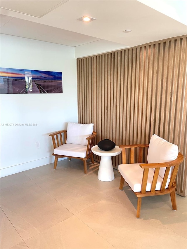 sitting room featuring tile patterned flooring