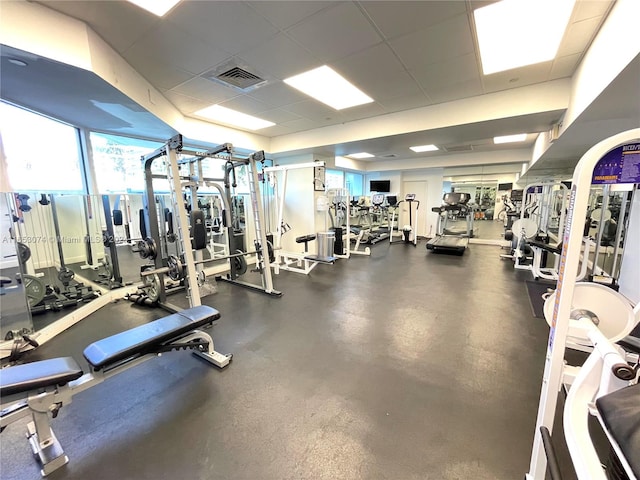 gym featuring a paneled ceiling