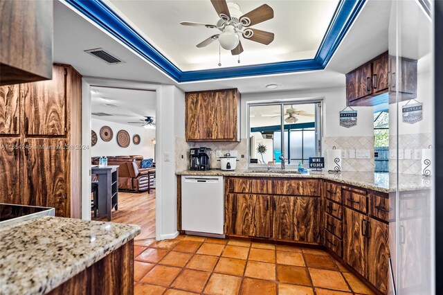 kitchen with dishwasher, ceiling fan, sink, and decorative backsplash