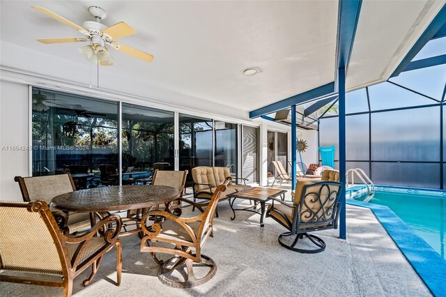 sunroom / solarium with ceiling fan