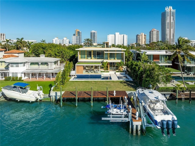 back of property with a water view