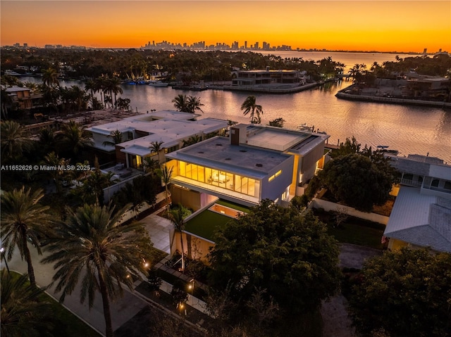 aerial view at dusk with a water view