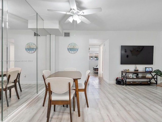 dining area featuring ceiling fan and light hardwood / wood-style floors