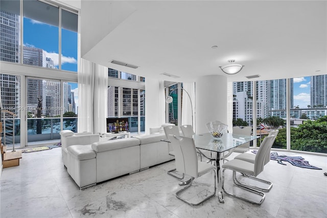 dining space featuring floor to ceiling windows and a wealth of natural light