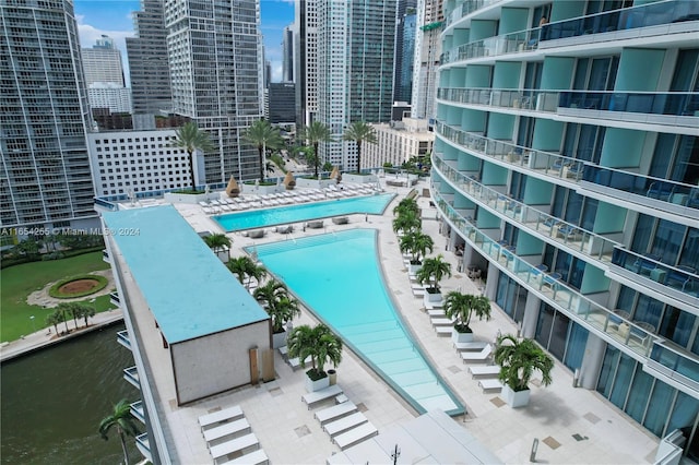 view of pool with a water view