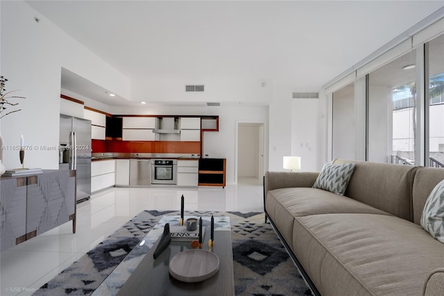 living room with light tile patterned flooring