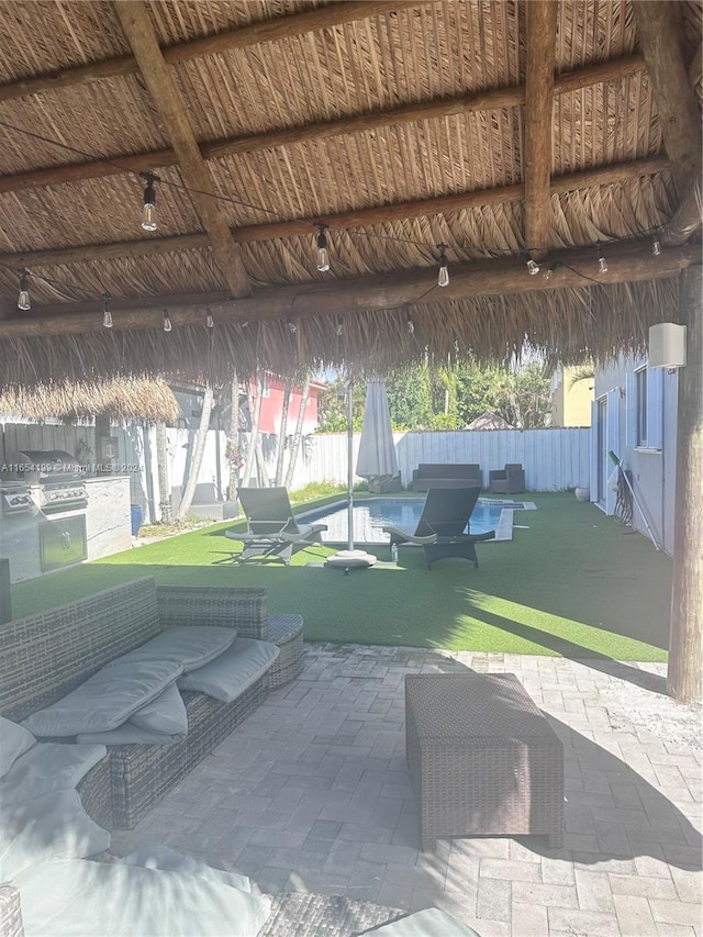 view of patio / terrace with outdoor lounge area and a gazebo