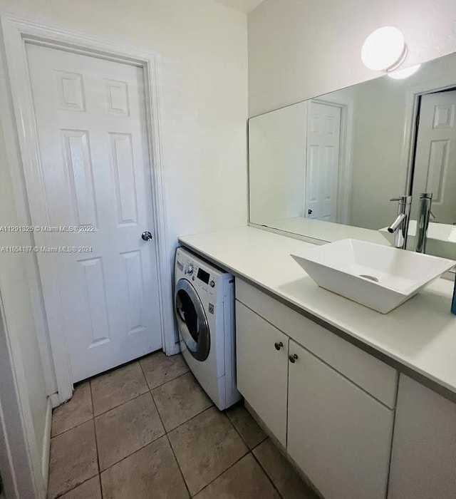 bathroom featuring washer / clothes dryer, tile patterned floors, and vanity