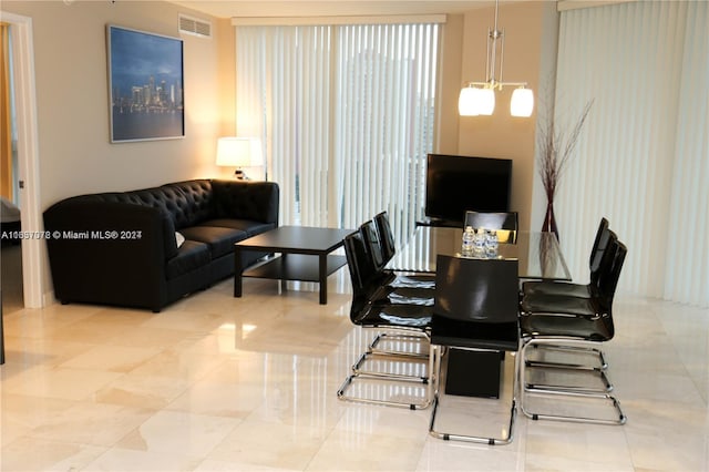 dining space with a notable chandelier