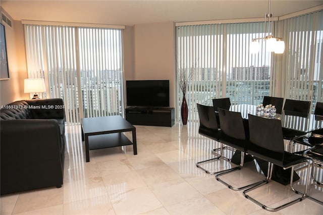 dining area with an inviting chandelier