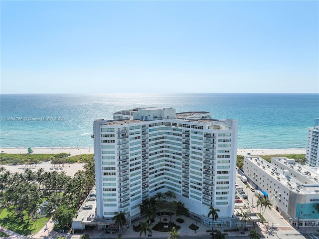 birds eye view of property featuring a view of the beach and a water view