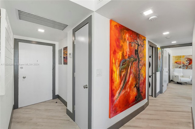 hallway featuring light hardwood / wood-style flooring