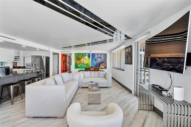 living room with light hardwood / wood-style floors