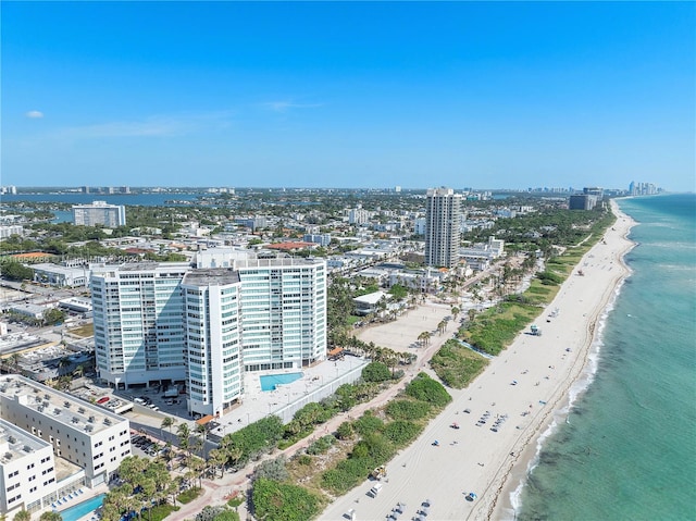 bird's eye view with a water view and a view of the beach