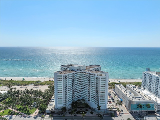 birds eye view of property featuring a water view and a view of the beach