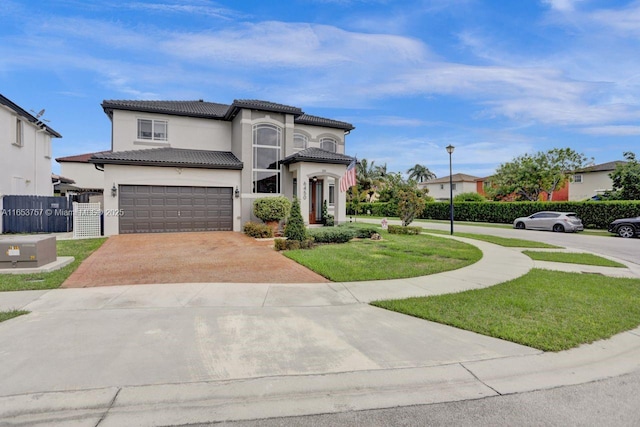 mediterranean / spanish-style house featuring a garage