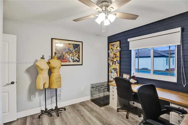 office with hardwood / wood-style floors and ceiling fan