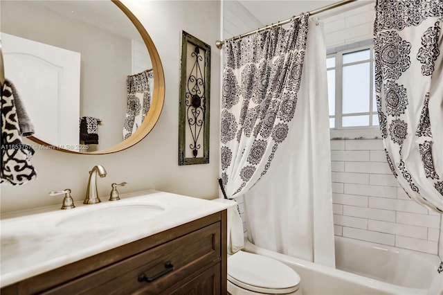 full bathroom with vanity, toilet, and shower / bath combo