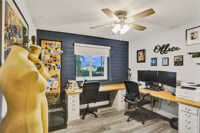 home office with ceiling fan and light hardwood / wood-style floors