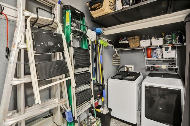 clothes washing area featuring separate washer and dryer