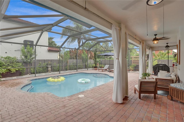 view of swimming pool featuring area for grilling, an outdoor hangout area, a patio, and a lanai