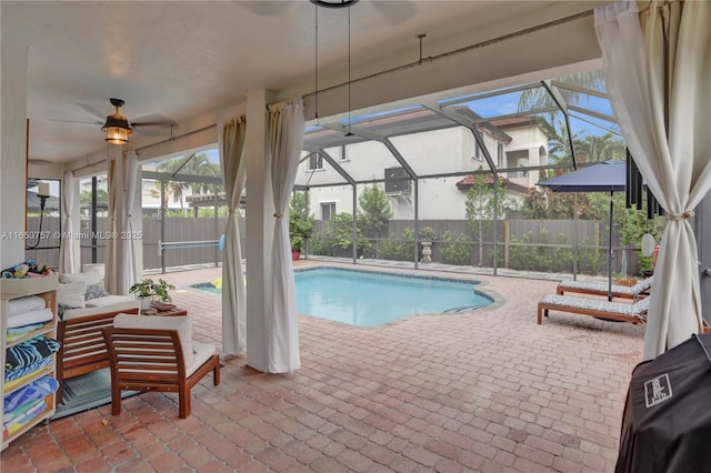 view of pool with outdoor lounge area, a lanai, and a patio area