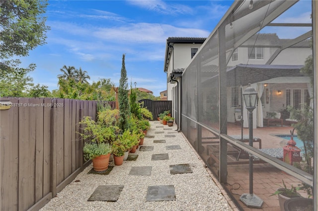 view of yard featuring a lanai and a patio area