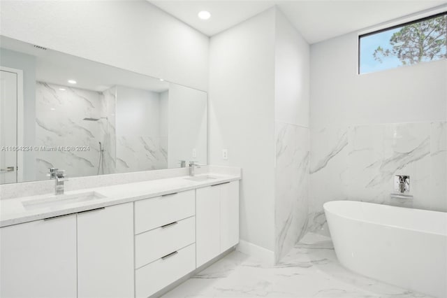 bathroom featuring a tub to relax in and vanity