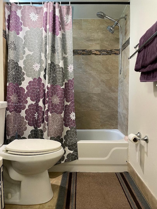 bathroom featuring toilet and shower / bathtub combination with curtain