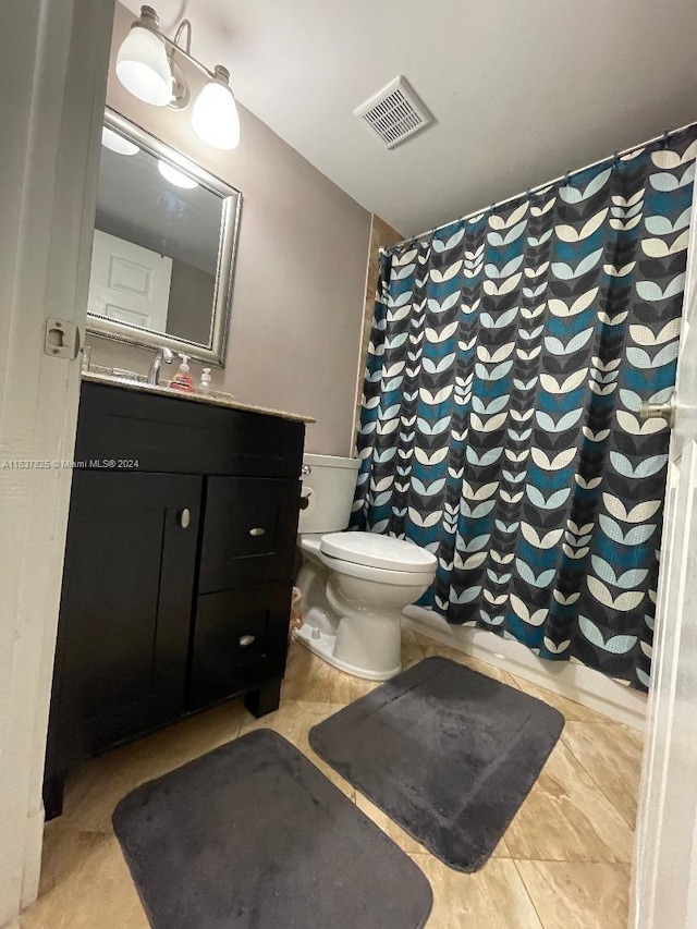 bathroom featuring vanity, toilet, and a shower with shower curtain