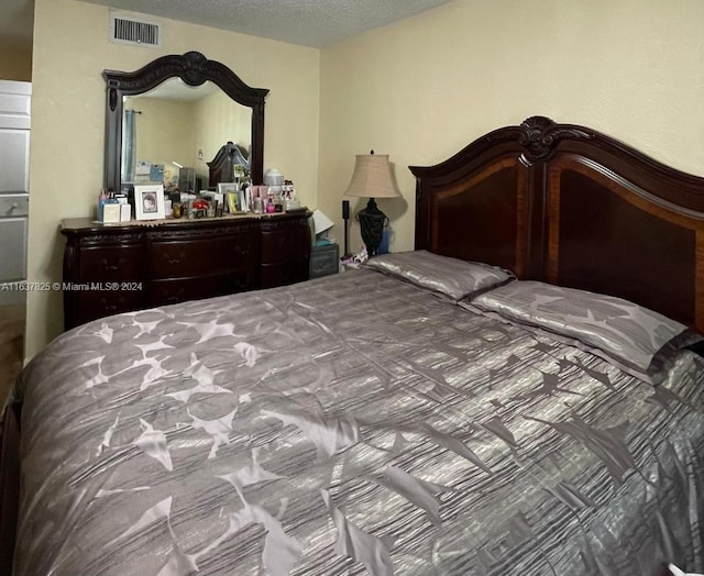 bedroom featuring a textured ceiling