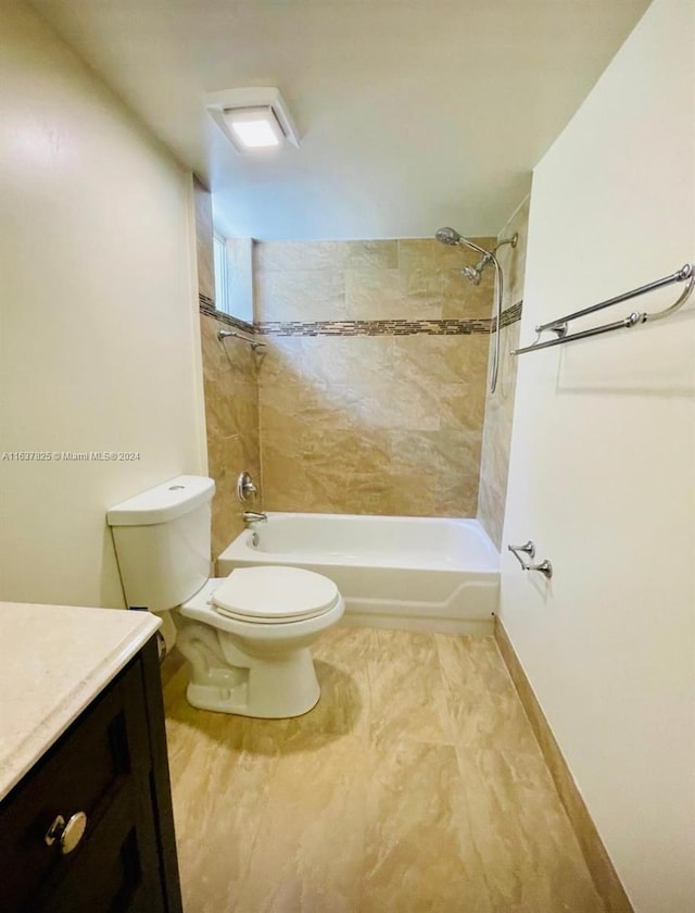 full bathroom with vanity, toilet, and tiled shower / bath combo