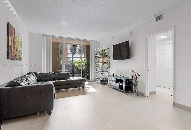 living room featuring ornamental molding, visible vents, a textured ceiling, and light tile patterned flooring