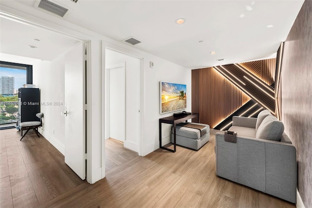 interior space featuring visible vents, baseboards, and wood finished floors