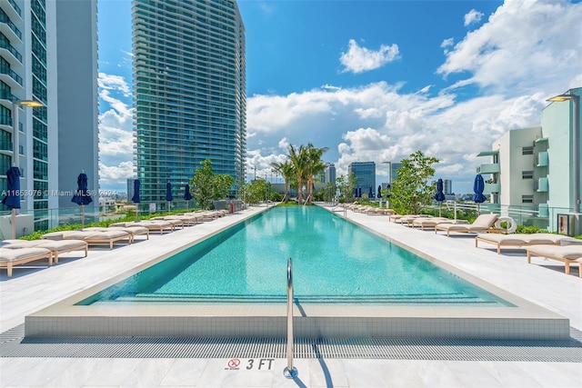 view of swimming pool with a patio